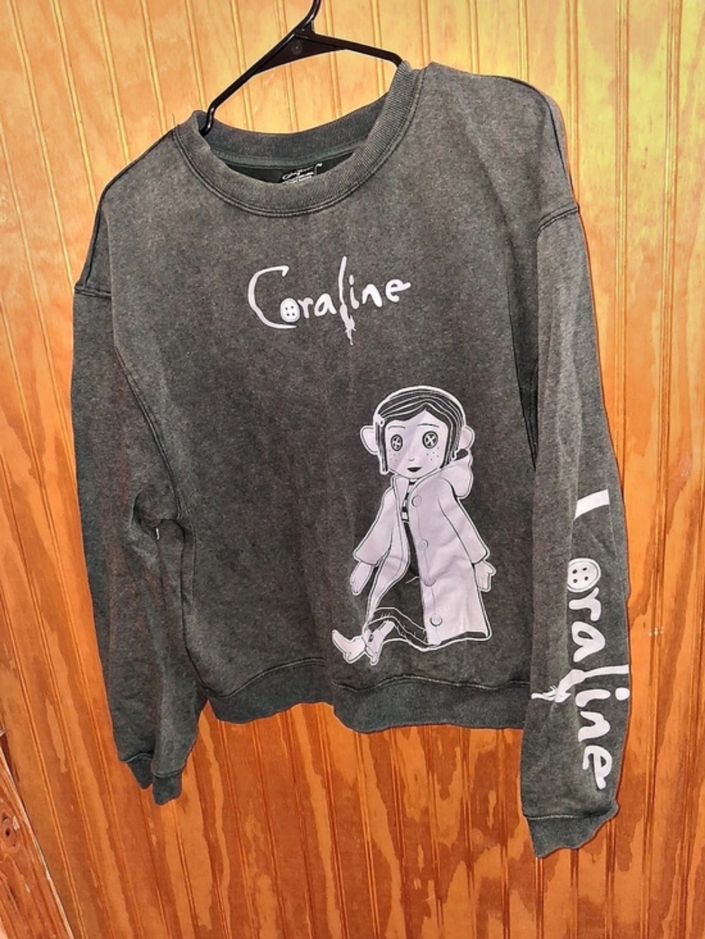 Coraline Graphic Long Sleeve Sweatshirt in Black